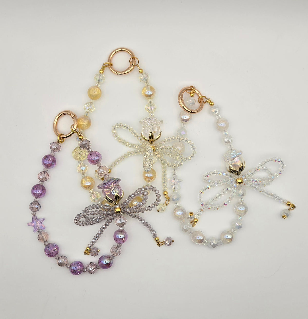 Crystal Bow phone charms in clear, purple and yellow with sparkling beaded bows and crystal accents