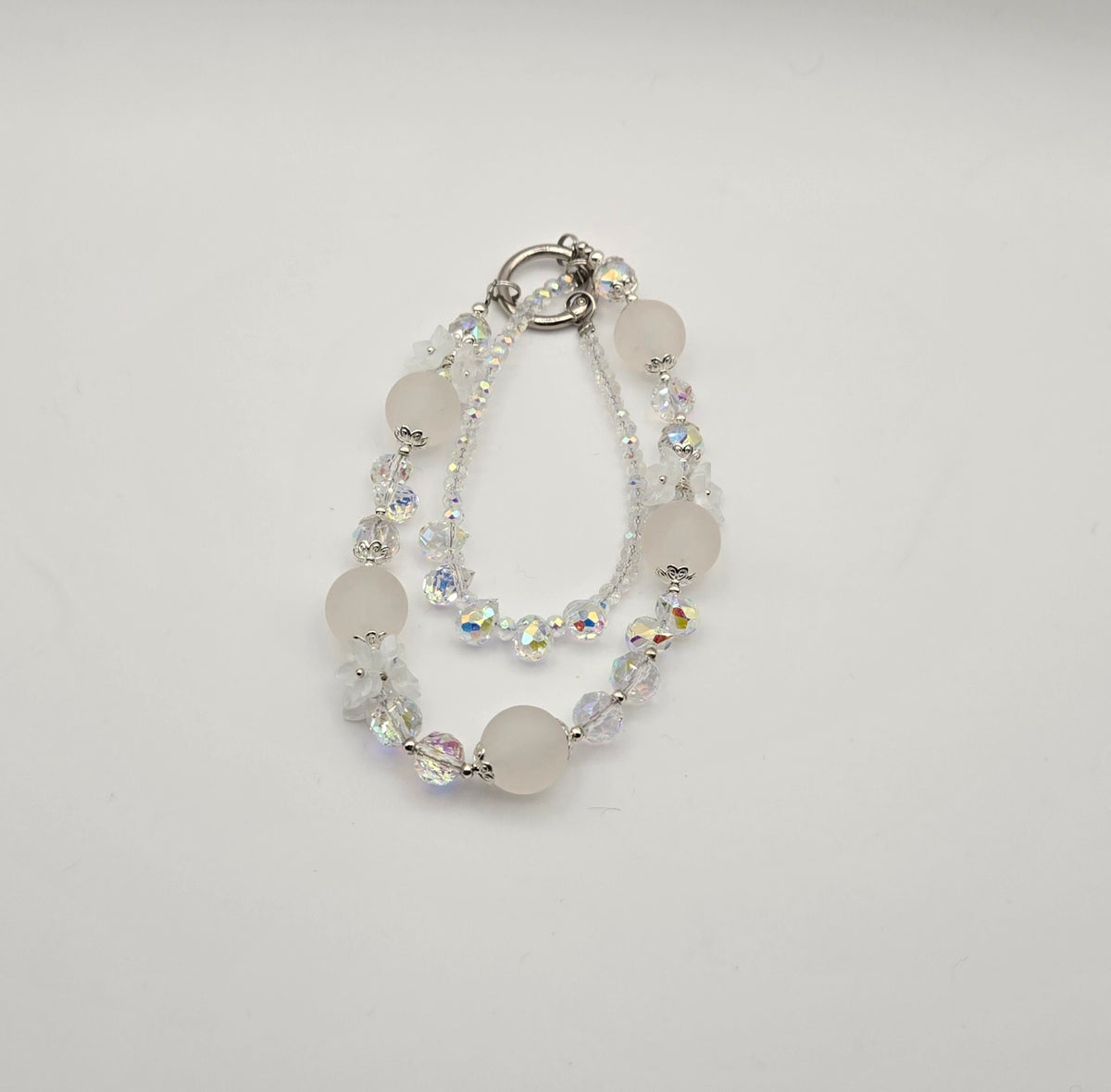 Crystal Bloom white Frosted Blossoms phone charm with frosted beads and iridescent crystal accents