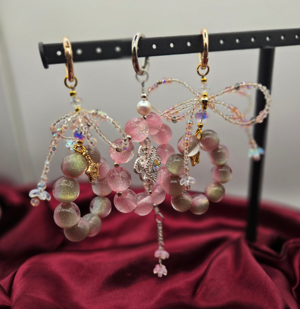 Starlit Blush pink beaded phone charms with sparkling bow, floral and celestial details