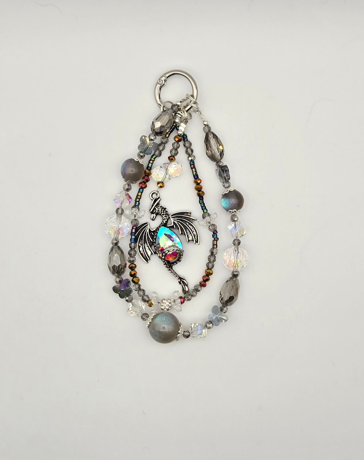 Crystal Keeper Dragon phone charm with clear crystal, silver and iridescent beaded strands