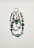 Emerald Keeper Dragon phone charm with green, black and silver beaded strands