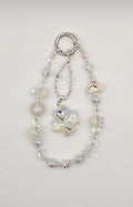 Crystal Wish Enchanted Clover phone charm with clear iridescent beads, floral accents and four-leaf clover focal