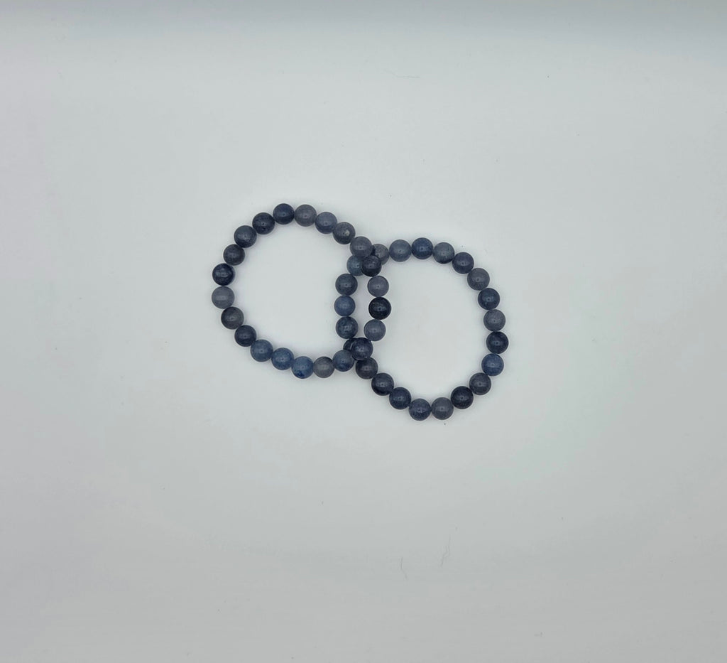 Two blue aventurine beaded bracelets showing natural variations in the blue stone beads
