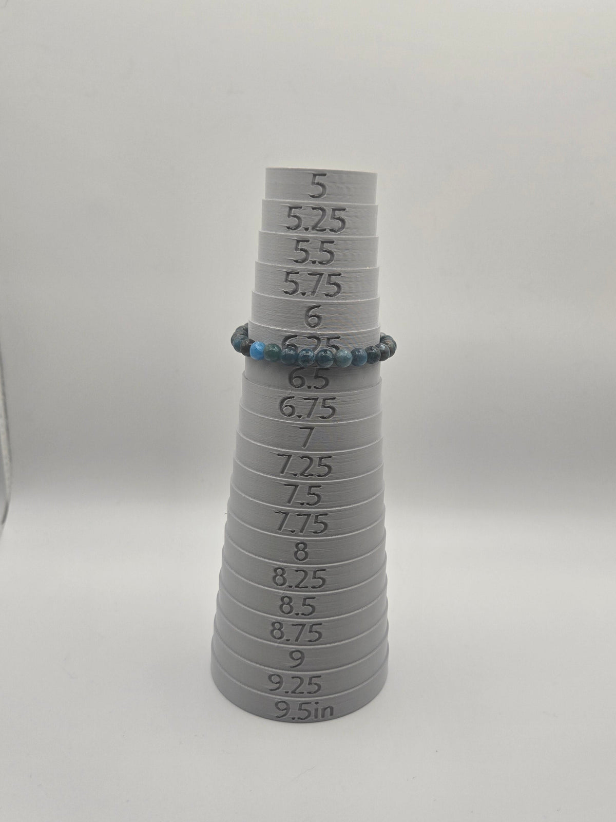 6mm blue apatite beaded bracelet measuring 6.25 inches on a sizing mandrel