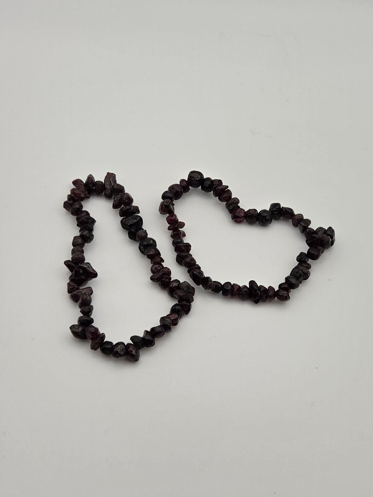 Two garnet chip bracelets showing deep burgundy natural stone variations